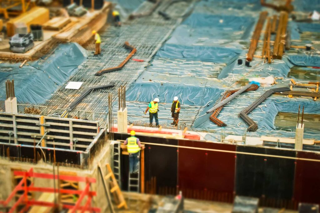 Professional building inspectors thoroughly examining structural foundations for cracks and stability issues