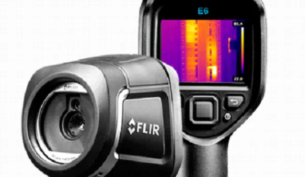 Using a thermal imaging camera to locate hidden termite nests behind walls.